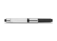 A silver and black KAWECO STANDARD CONVERTER for fountain pens.