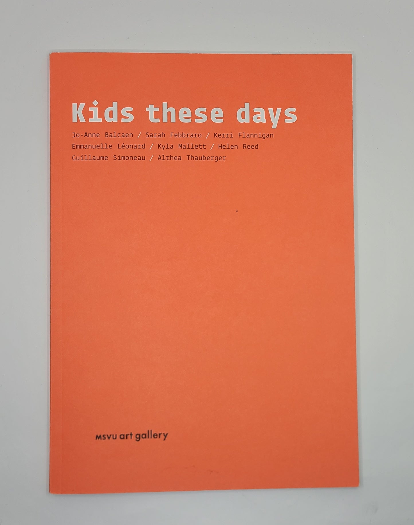 Book cover with 'Kids these days' text on an orange background