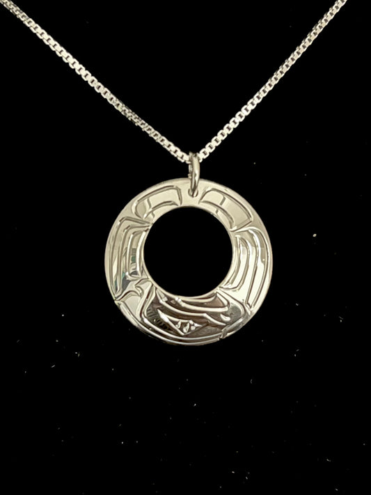Silver pendant eagle necklace on a black background