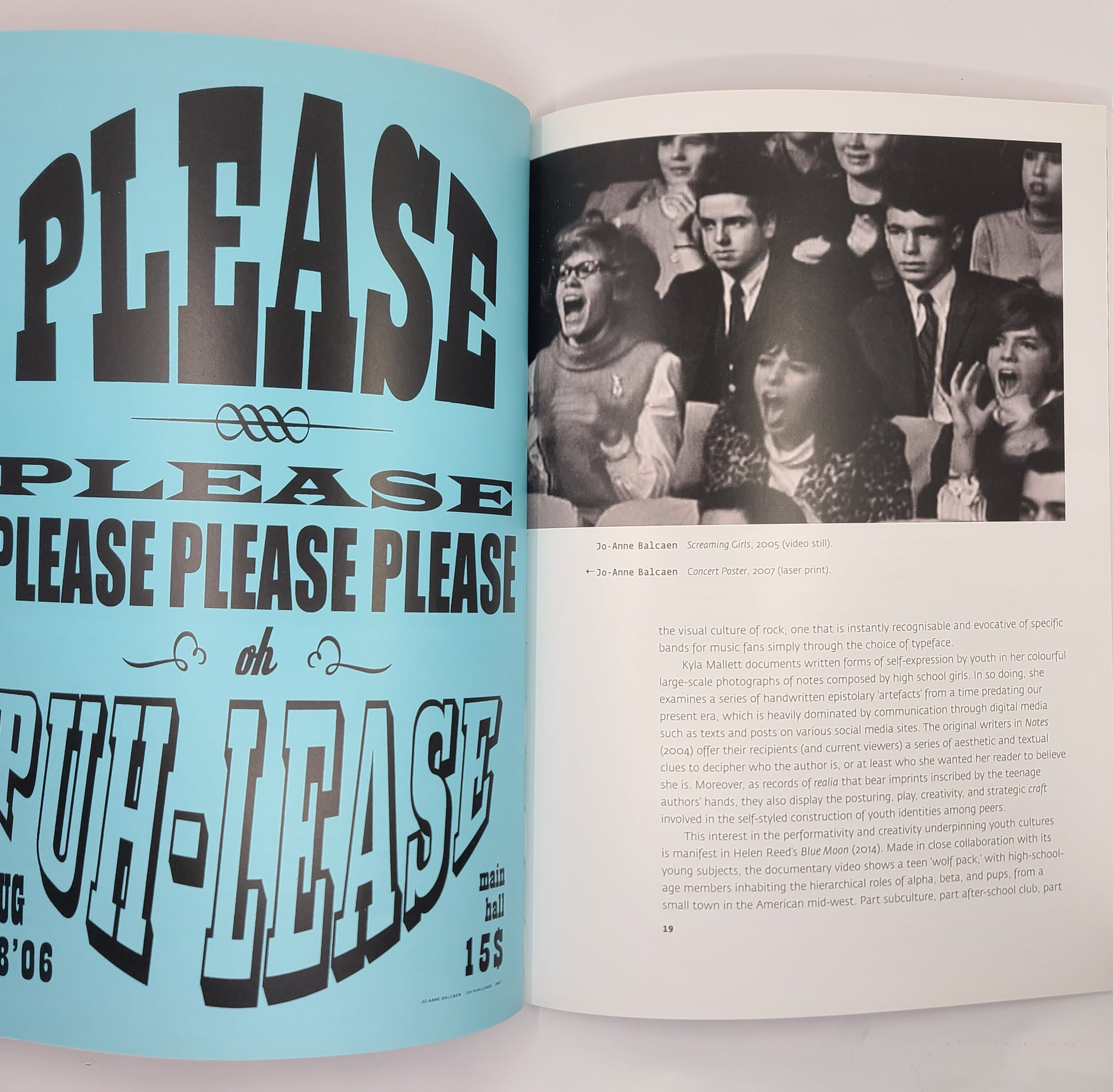 Open book with text and a black and white photo of people on a light blue background