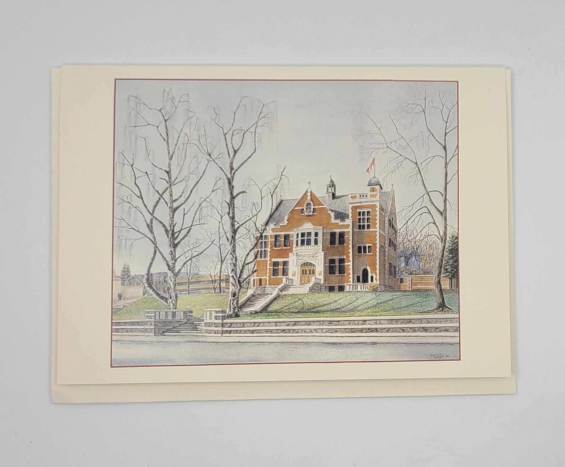 Framed artwork of a ref large bricked building with trees on a gray background