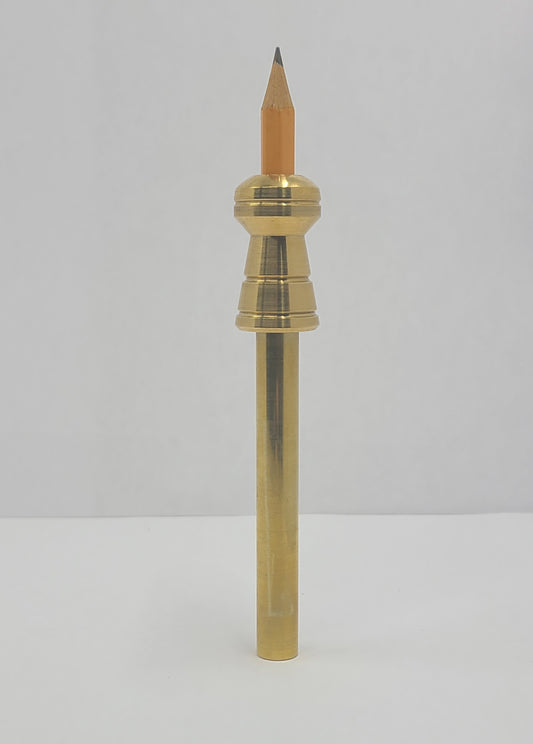 Brass pen with a wooden tip on a light gray background