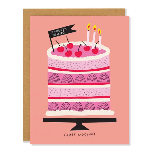Greeting card of a pink cake with candles and a flag saying "Forever Yong" illustration.  Text reading "(just kidding)" Bellow on a pink background.