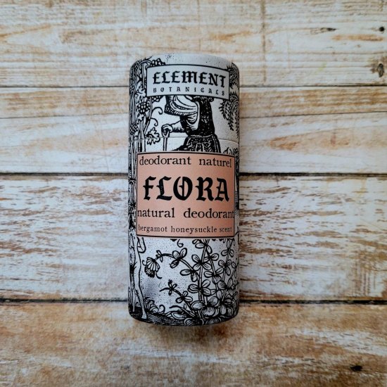 A tube of deodorant named 'Flora' in a limited edition packaging featuring a black and white illustration.